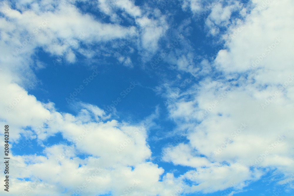 Beautiful blue sky and white fluffy cumulus clouds. Background. Landscape. Beautiful blue sky and white fluffy cumulus clouds. Background. Landscape.