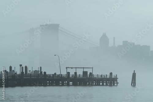 Rainy Manhattan, business district of New York City, heavy fog.