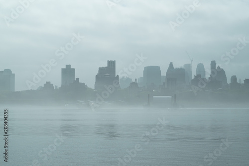 Photography Rainy Manhattan, business district of New York City, heavy fog.