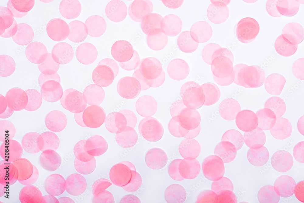 Pink confetti on white background