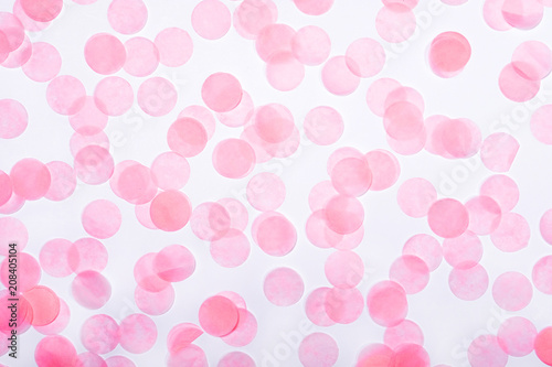 Pink confetti on white background