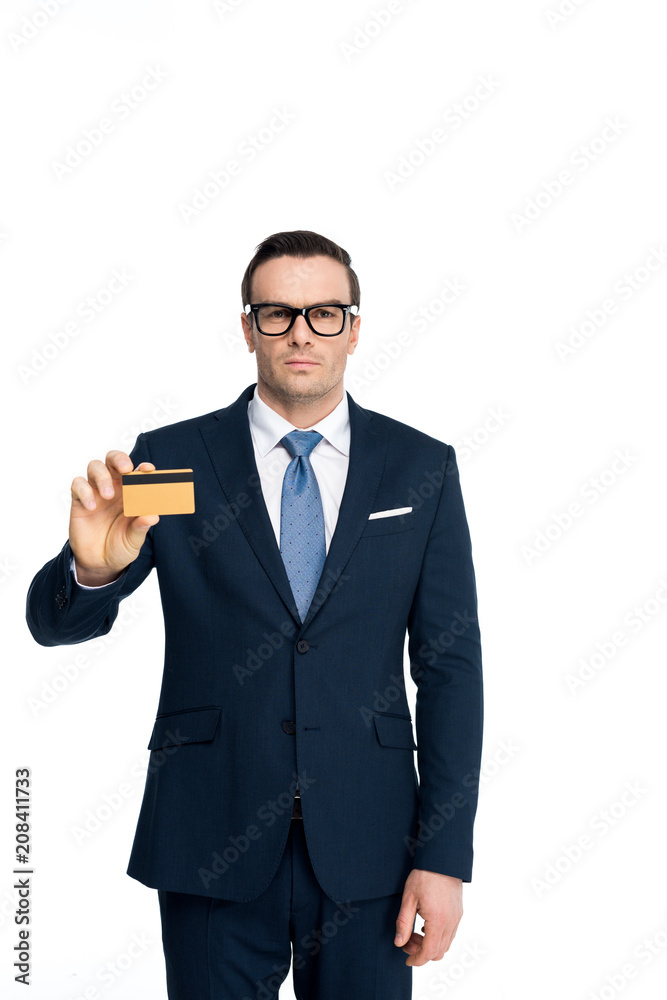 handsome businessman in eyeglasses holding credit card and looking at camera isolated on white handsome businessman in eyeglasses holding credit card and looking at camera isolated on white