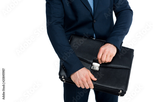 mid section of businessman in formal wear holding briefcase isolated on white