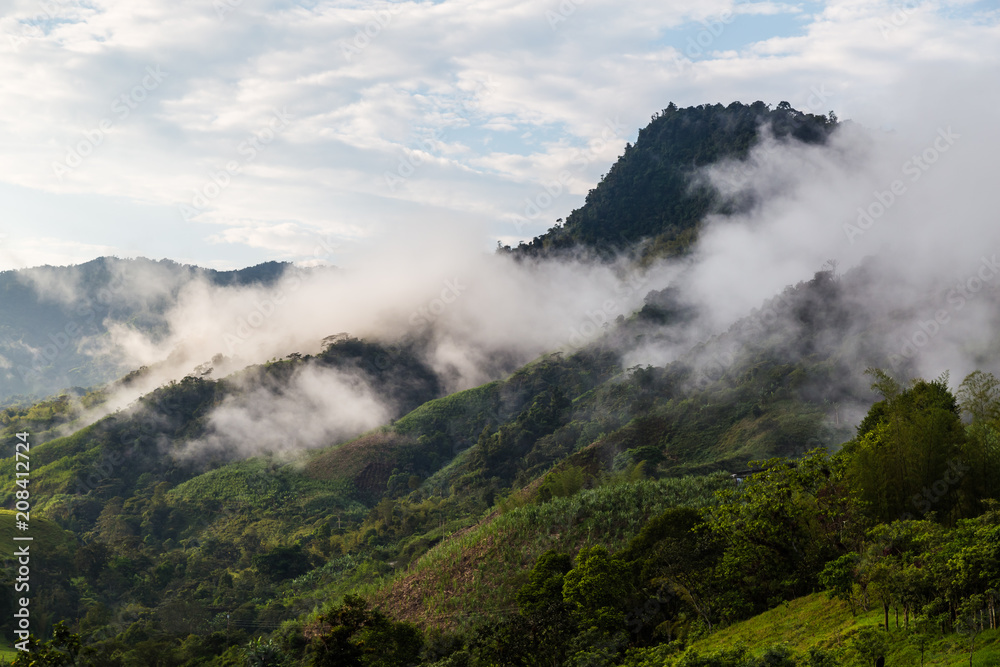 Landscape with clouds, jungles, mountains and crops Andes, Ecuador