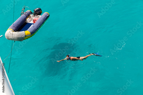 Fényképezés Inflatable rubber boats and sunbathers in the crystal-clear turquoise water
