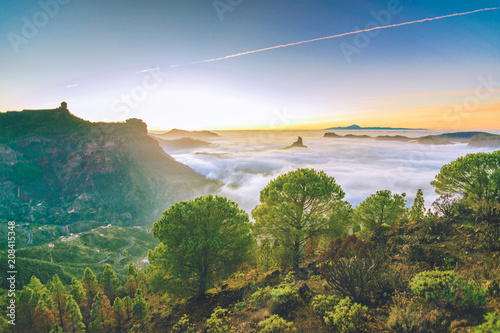 Nature landscape with a beautiful sunset. With views of Tenerife and Mount Teide. With a sea of ​​clouds between the two islands.
