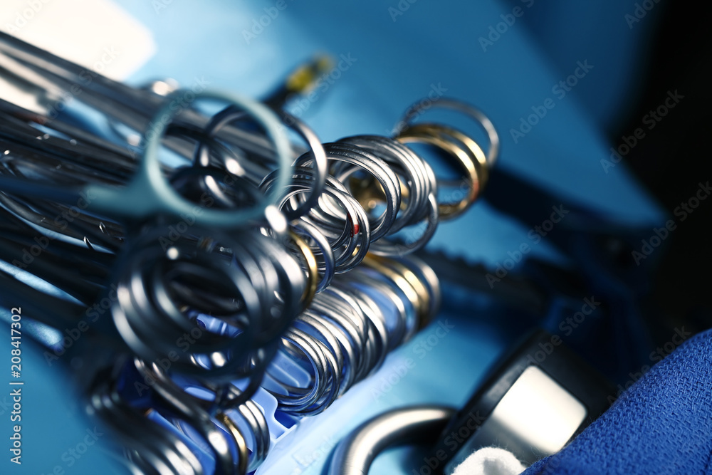 Shiny surgical tools on the sterile table
