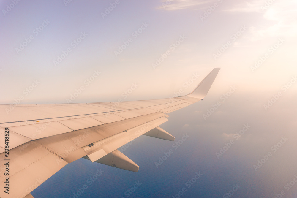 view from the airplane window, ocean blue, sunny day. Vacation concept view from the airplane window, ocean blue, sunny day. Vacation concept