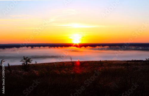 Misty dawn in the field photo