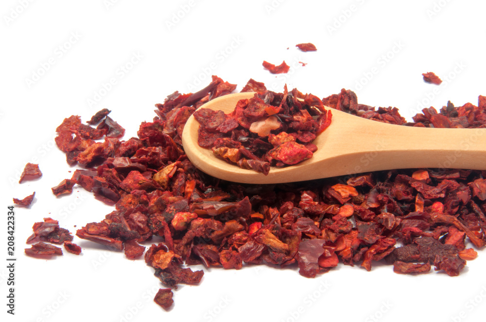 Dried bell pepper or paprica red spice in spoon isolated on the white Dried bell pepper or paprica red spice in spoon isolated on the white