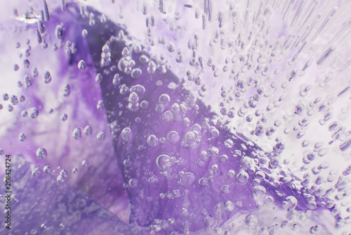 Airy delicate bubbles flowing through ice with purple colors underneath 7