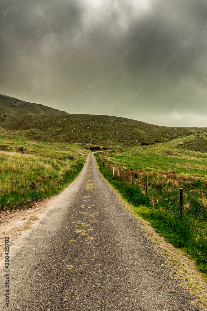 Scenic roads at Caherconree, a 835 meter high mountain on the Dingle Peninsula in County Kerry, Ireland, the second-highest peak of the Slieve Mish Mountains.