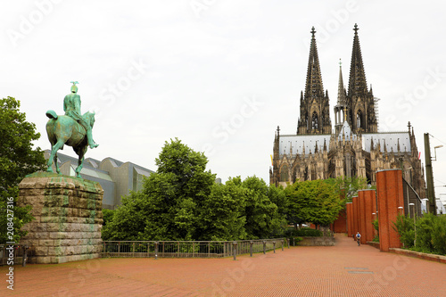 Rear view of Equestrian Statue of Kaiser Wilhelm II with Cologne Cathedral on the background, Germany photo