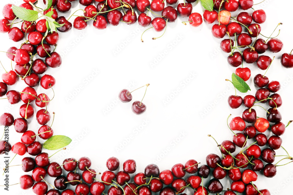 Cherry. Red fresh Cherries in bowl and a bunch of cherries on the table Cherry. Red fresh Cherries in bowl and a bunch of cherries on the table
