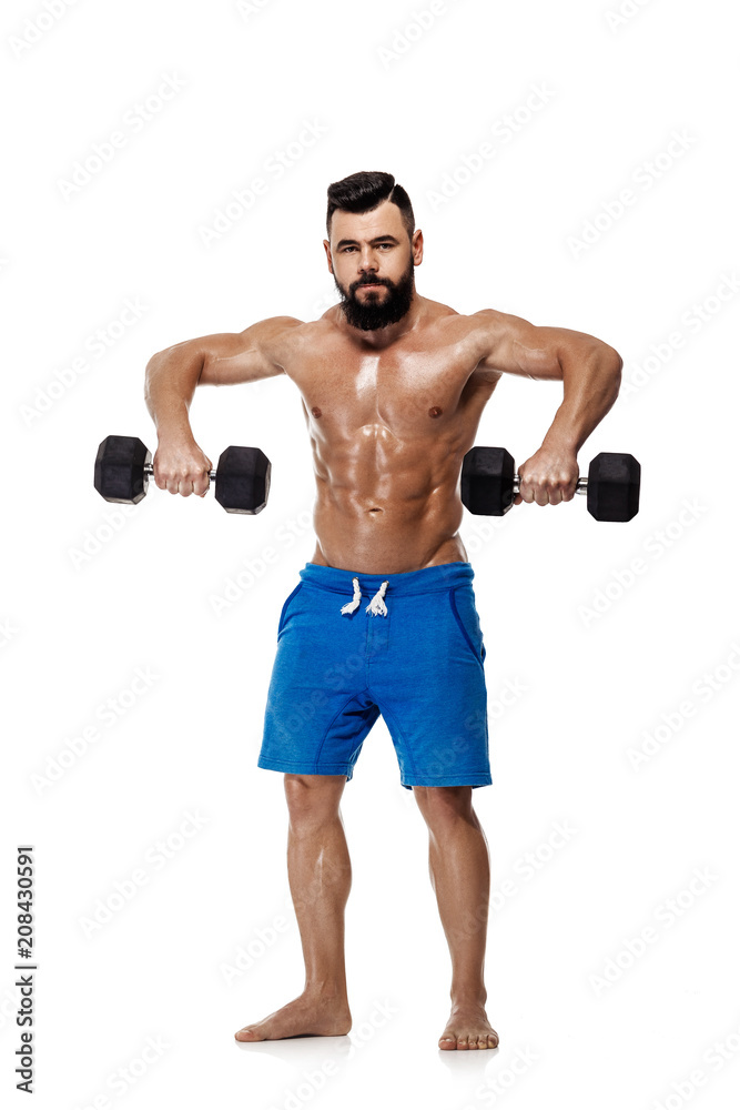 muscular man doing exercises with dumbbells.