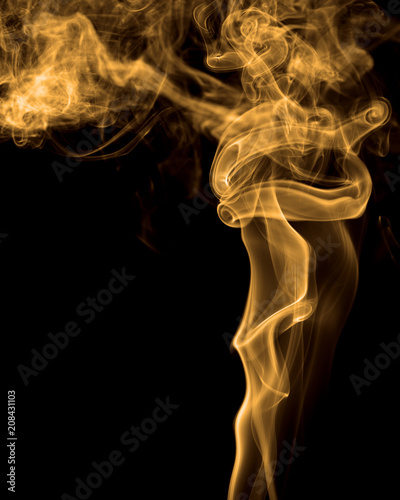 Smoke rising against black background