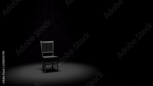 Metal Chair in a Spotlight in a Dark Black Room