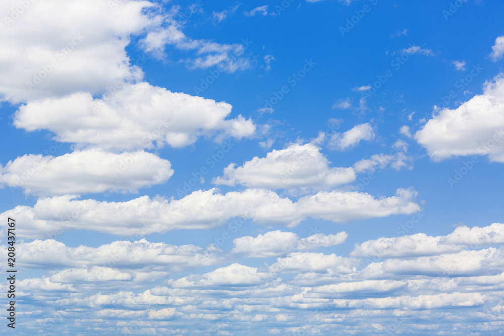 Blue sky with white puffy clouds. Clouds in the blue sky. Blue sky with white puffy clouds. Clouds in the blue sky.