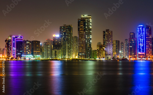 Sharjah waterfront cityscape in UAE at night © creativefamily