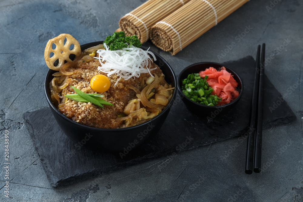 Rice bowl topped with fried pork cutlet Katsudon, tonkatsu donburi
