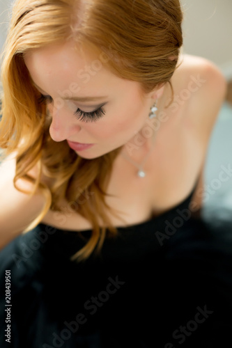 Girl in back dress with long lashes