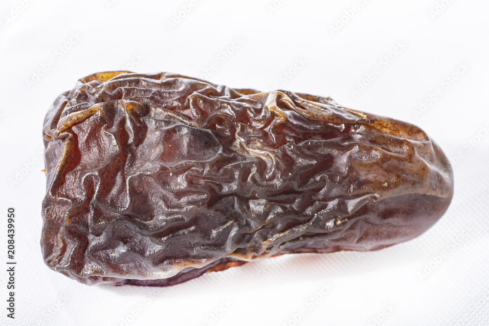 dried dates on a white background