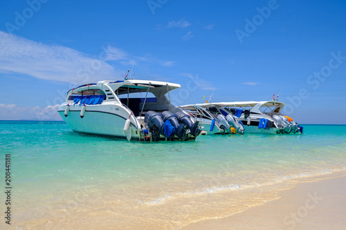 Speedboats at the beautiful beach of tropical island, in waiting for passengers. © SSV-Photo