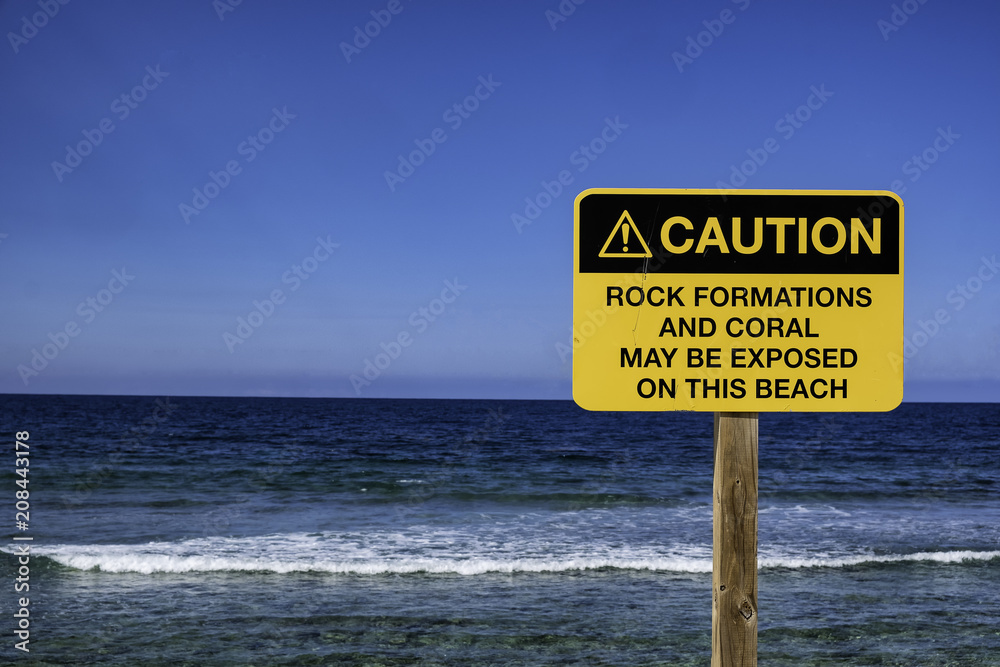 Caution sign on beach