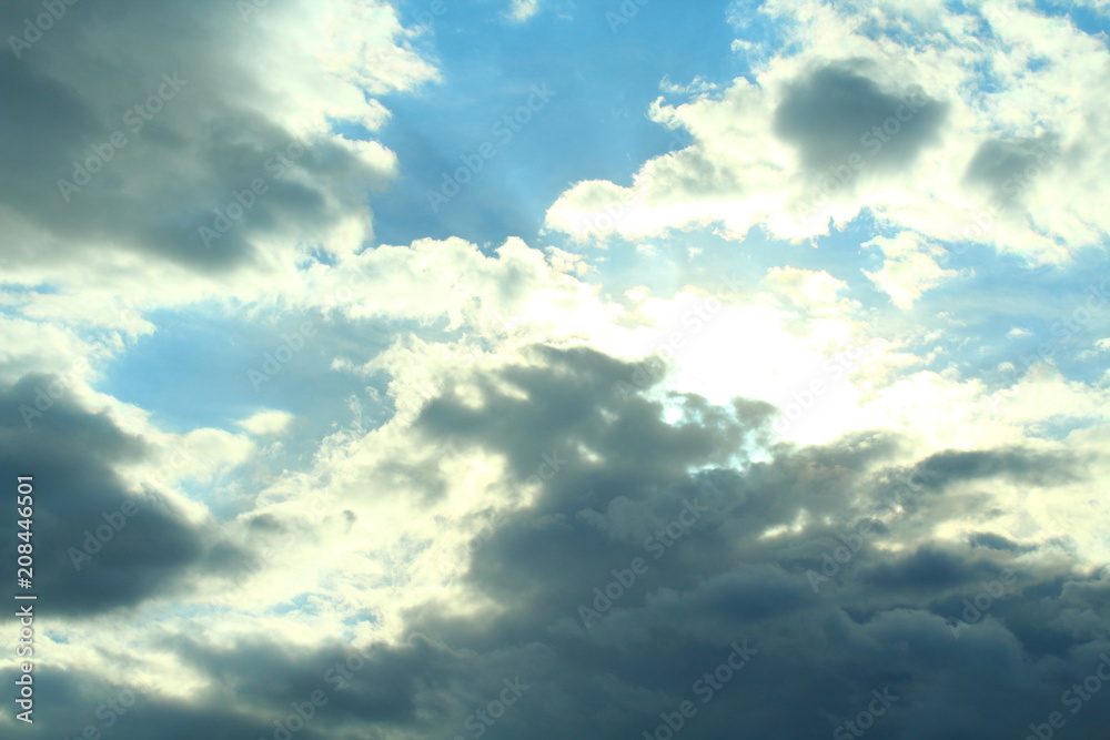 Fototapeta premium A beautiful cloudy sky, cumulus clouds and scorching sun. Background. Landscape.