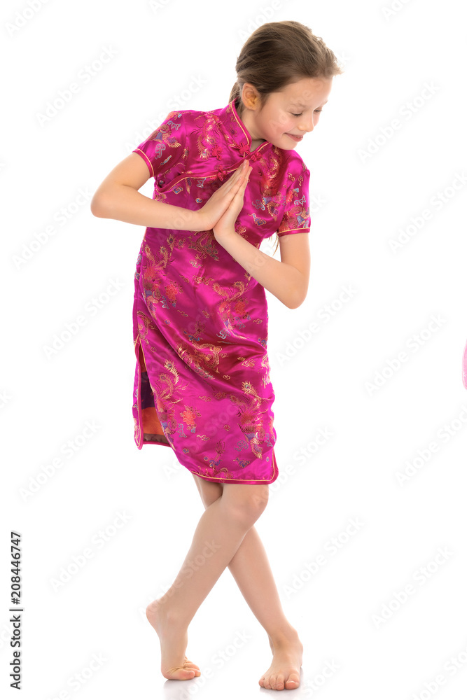 Little girl in a Chinese national dress. Little girl in a Chinese national dress.