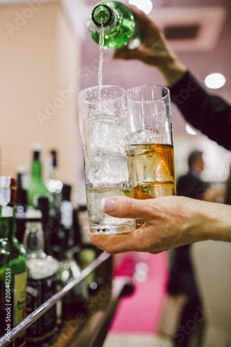 Waiters preparing cocktails