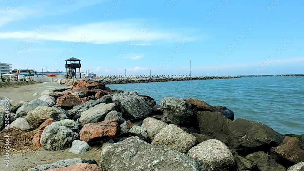 scenic view of rocks on the sandy coast of Emilia Romagna in Italy scenic view of rocks on the sandy coast of Emilia Romagna in Italy