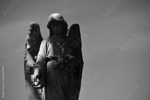 Sculpture of an angel on a tomb of the cemetery of Montreal-Canada