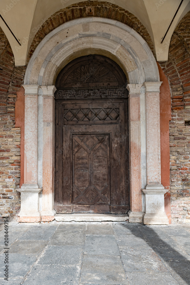Old wooden carved entrance door to a chuch