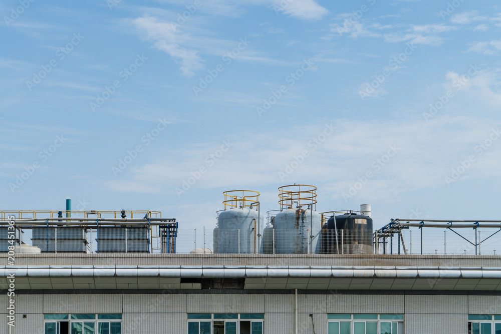 Factory building in the suburbs, industrial plant background