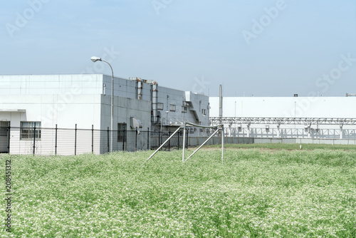 Factory building in the suburbs, industrial plant background