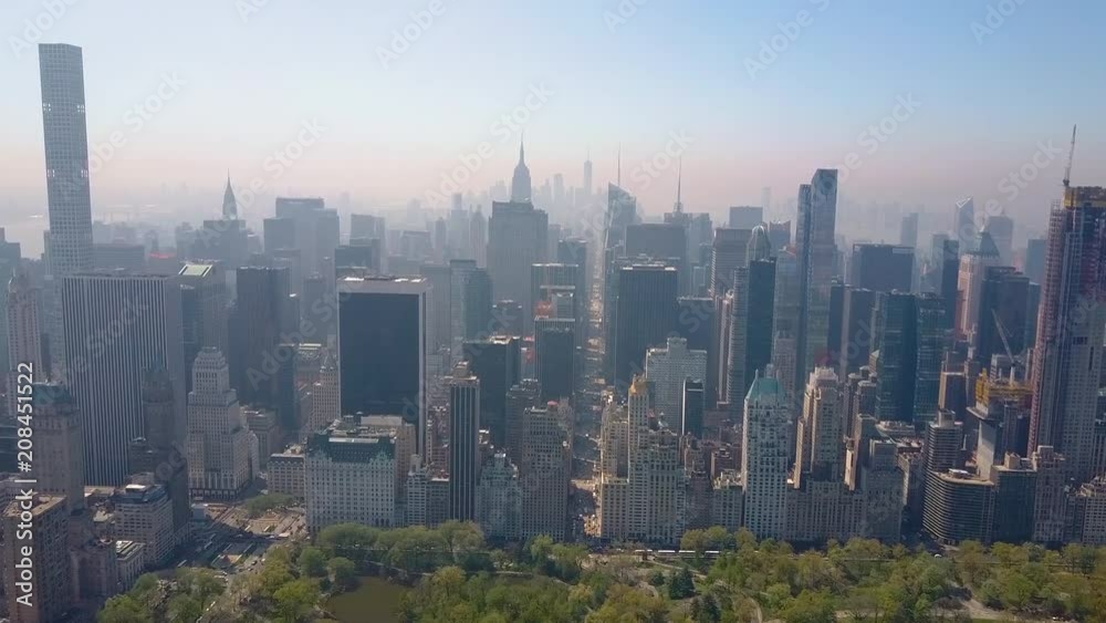 Aerial view of Central Park, New York, USA, Skyscrapers on background. Luxury residential buildings. Aerial view of Central Park, New York, USA, Skyscrapers on background. Luxury residential buildings.