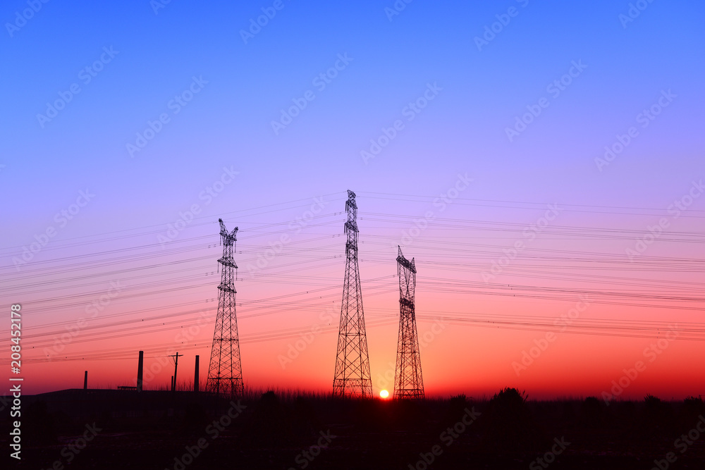 High piezoelectric towers, in the setting sun