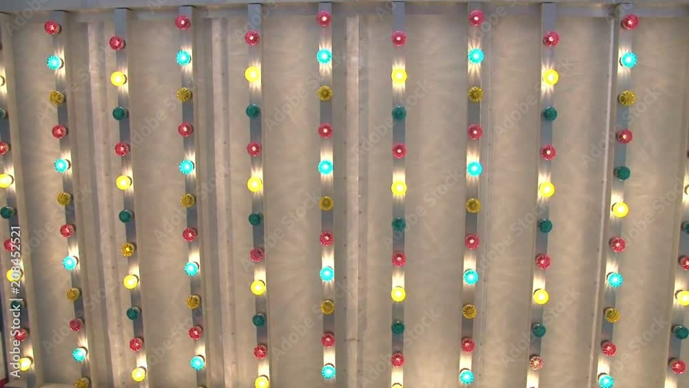 A group of rows of multi colored lights, flashing randomly, crazy, and make you want to dance.
