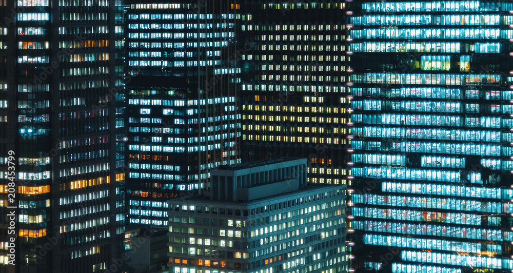 Skyscrapers illuminated at night in Tokyo, Japan Skyscrapers illuminated at night in Tokyo, Japan