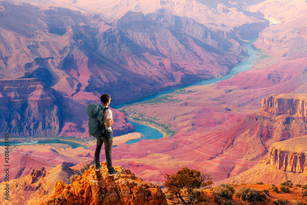 Obraz premium Traveler Man relaxing meditation with serene view mountains and lake landscape, Travel Lifestyle hiking concept summer vacations outdoor