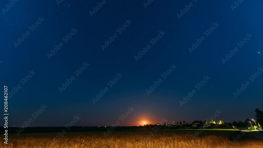 Time Lapse Time-lapse Timelapse Of Moonrise Above Belarusian Village In Eastern Europe. Belarusian House In Village Or Countryside Of Belarus In Summer Starry Night Time Lapse Time-lapse Timelapse Of Moonrise Above Belarusian Village In Eastern Europe. Belarusian House In Village Or Countryside Of Belarus In Summer Starry Night