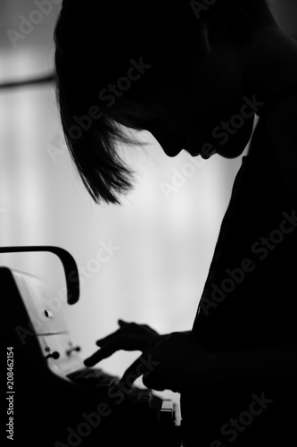 Profile of a child typing on an old mechanical typewriter