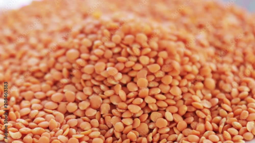 red lentil texture in the background. natural products background. Rotation video red lentil texture in the background. natural products background. Rotation video
