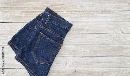 Short Denim on rustic white wooden Table