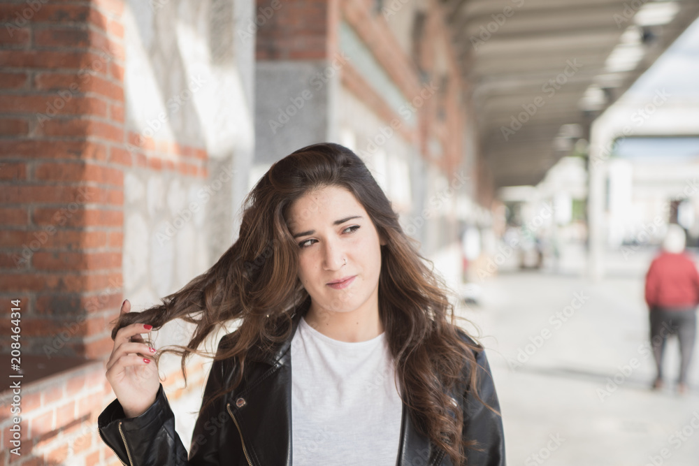 beautiful girl playing with her long hair beautiful girl playing with her long hair