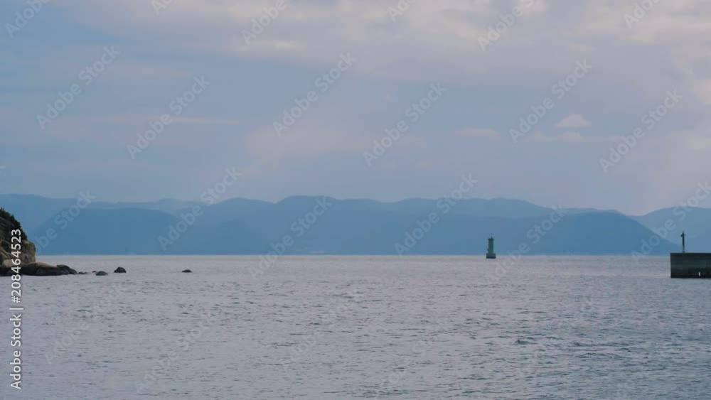 Peaceful Ocean, Floating Pontoon with Mountain Landscape after sunset Peaceful Ocean, Floating Pontoon with Mountain Landscape after sunset