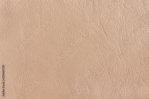 Texture genuine leather beige color. Background, texture. photo