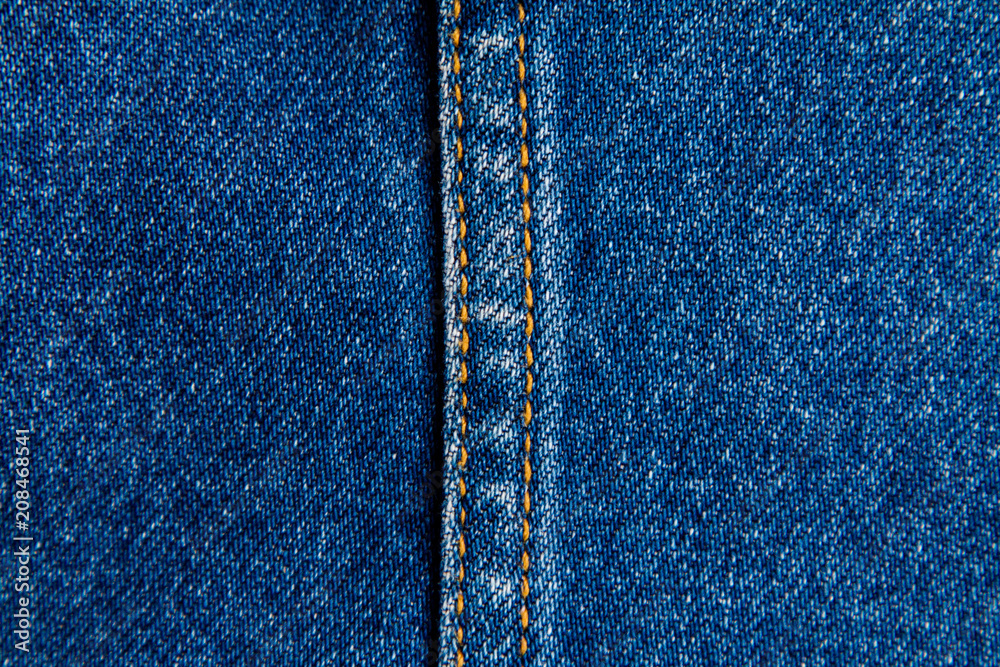 part of blue worn denim close-up, background part of blue worn denim close-up, background
