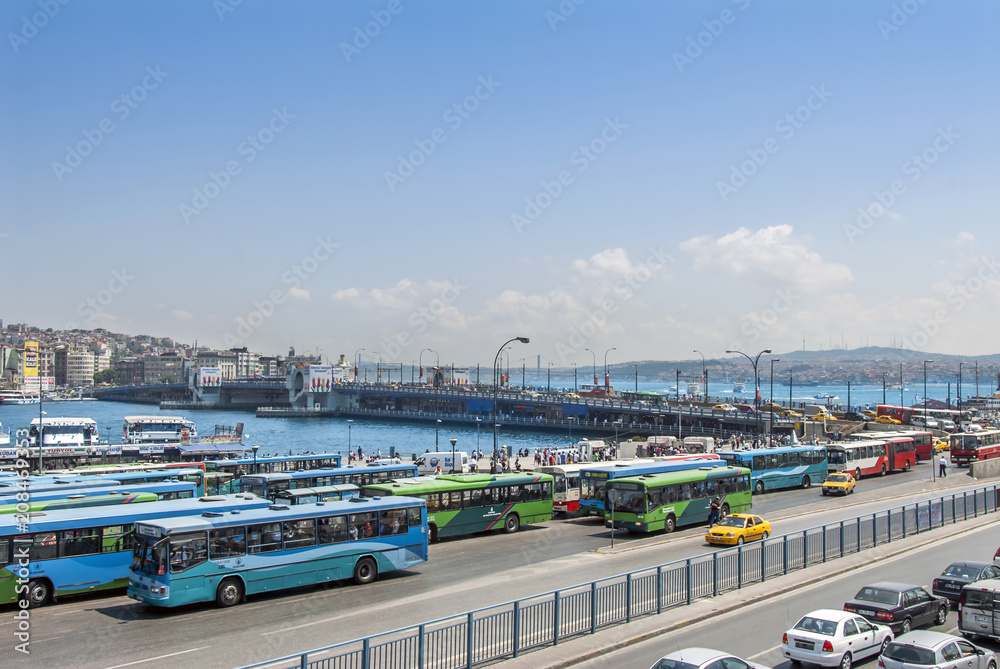 Istanbul, Turkey, 22 June 2006: The Galata Bridge and buses in the Eminonu district of Istanbul.